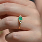 Medium-close photo of the vintage ring on the hand of a Caucasian model's left ring finger in order to show scale when worn.