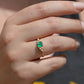 Medium-close photo of the vintage ring on the hand of a Caucasian model's right ring finger in order to show scale when worn.