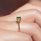 Macro photo of the vintage ring on the hand of a Caucasian model's right ring finger in order to show scale when worn. View is from the side to highlight the rise of the ring off the finger when worn.